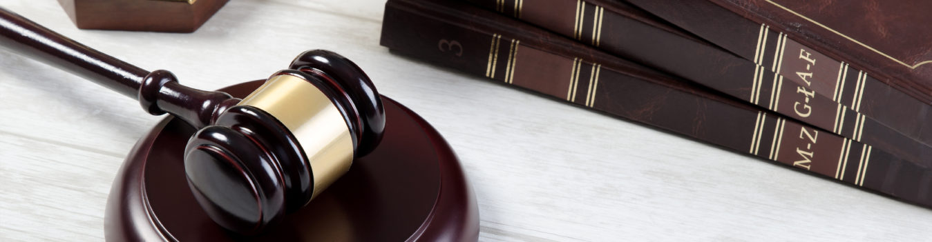 law books and a gavel - Florida Condo Attorneys